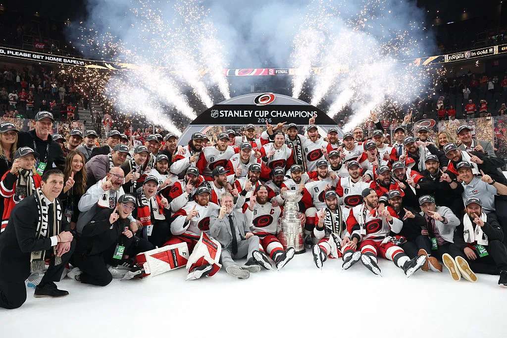 The Carolina Hurricanes pose for a picture after winning in Game Six of the 2026 Stanley Cup Final against the Vegas Golden Knights 3-0 at T-Mobile Arena on June 14, 2026 in Las Vegas, Nevada. (Photo by Sean M. Haffey/Getty Images)